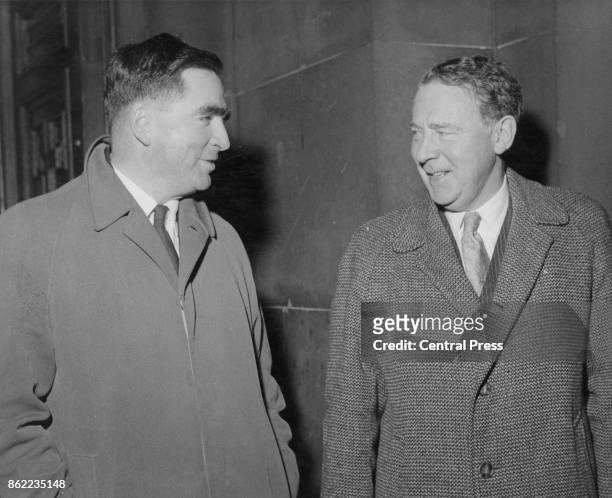 Hugh Gaitskell , Leader of the Labour Party, and Labour MP Denis Healey leave the Foreign Office in London after seeking assurances from the Foreign...