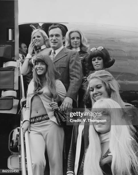 American publisher Hugh Hefner arrives at London Airport in his private DC-9 jet airliner 'Big Bunny', with an entourage of Playboy Bunnies, and his...