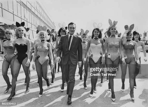 American publisher Hugh Hefner arrives at London Airport from Chicago with an entourage of Playboy Bunnies, 26th June 1966. He is in the capital for...