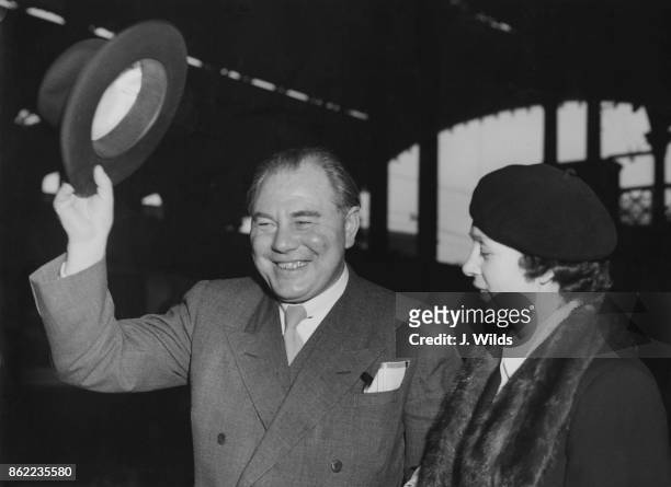 Hans Hedtoft , the Prime Minister of Denmark, arrives at Liverpool Street Station in London with his wife Ella, to attend the Anglo-Danish Society...