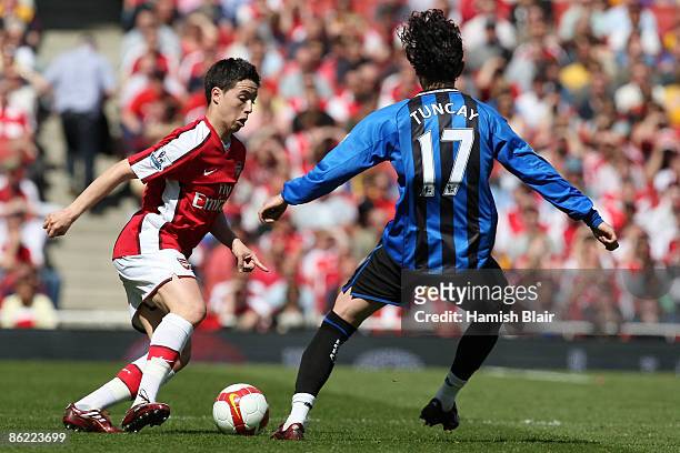 Samir Nasri of Arsenal battles for the ball with Tuncay Sanli of Middlesbrough during the Barclays Premier League match between Arsenal and...