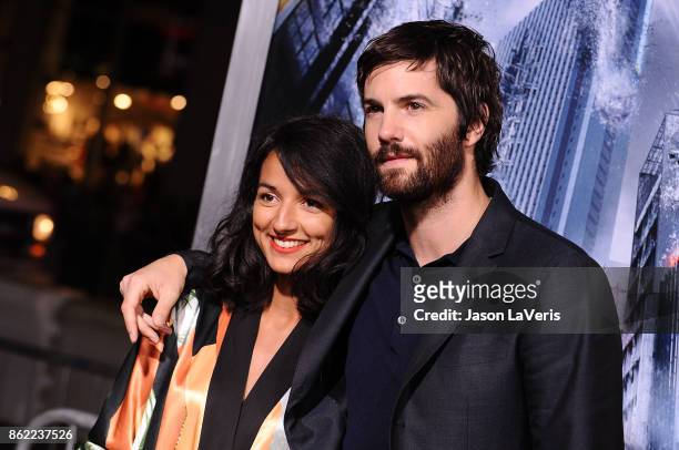 Actor Jim Sturgess and Dina Mousawi attend the premiere of "Geostorm" at TCL Chinese Theatre on October 16, 2017 in Hollywood, California.