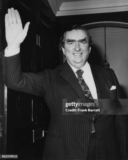 British politician Denis Healey , the Chancellor of the Exchequer, leaves 11 Downing Street for the House of Commons, 21st February 1977. He is...