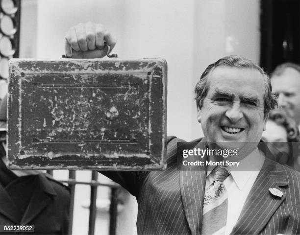 British politician Denis Healey , the Chancellor of the Exchequer, leaves 11 Downing Street for the House of Commons with the budget box on Budget...