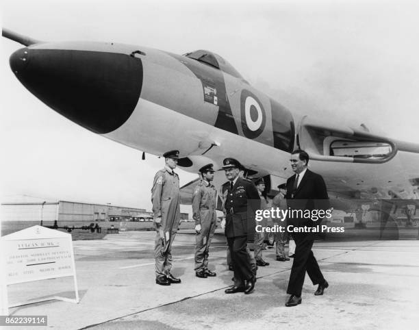 British Labour politician Denis Healey , the Secretary of State for Defence, inspects the crew of a Vulcan B.2 bomber with Air Chief Marshal Sir...