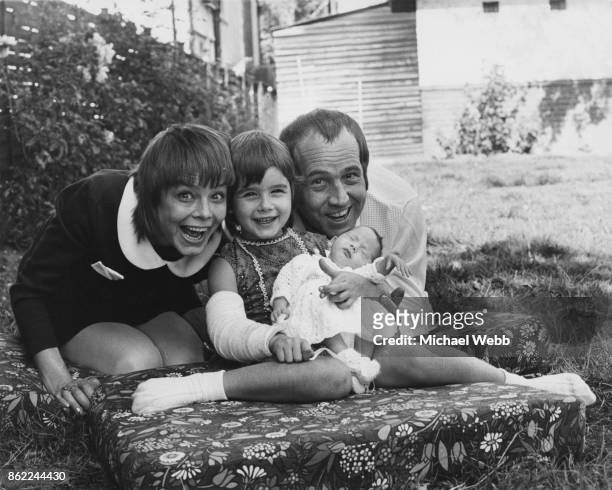 English actor Ian Hendry with his wife, actress Janet Munro , their 6-year-old daughter Sally, and their new baby daughter Alexandra Corrie, in the...