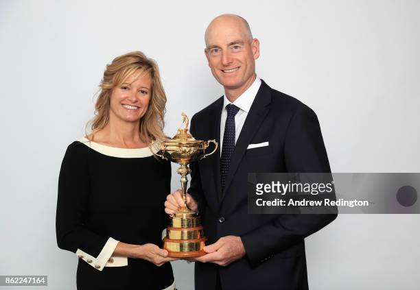 Jim Furyk of the United States, Team Captain of Team America and his wife Tabitha Furyk pose for a portrait with the Ryder Cup during the Ryder Cup...