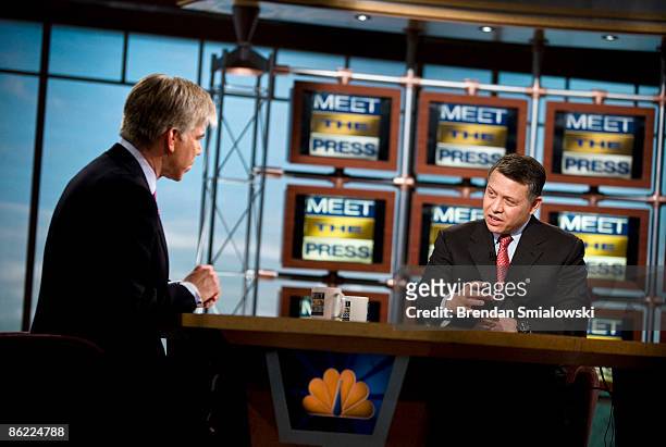 David Gregory listens to King Abdullah II of Jordan speak during a pre-taping of "Meet the Press" at NBC April 24, 2009 in Washington, DC. King...