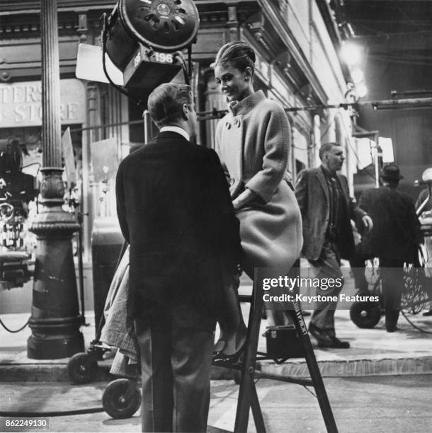 Actress Audrey Hepburn and actor George Peppard on the set of the film 'Breakfast at Tiffany's', June 1961.