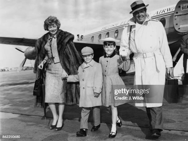 American actress Lucille Ball and her husband Desi Arnaz arrive at London Airport with their children Lucie and Desi Jr., 10th June 1959. They have...