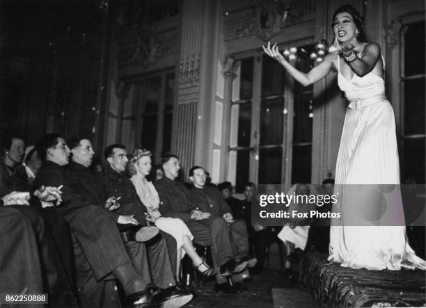 American-born French entertainer Josephine Baker performs for troops at the British Leave Club at the Hotel Moderne in Paris, World War II, May 1940.