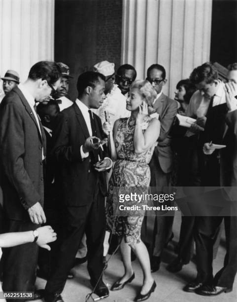 American writer James Baldwin is interviewed by the media in front of the Lincoln Memorial during the March on Washington, Washington, DC, 1963.