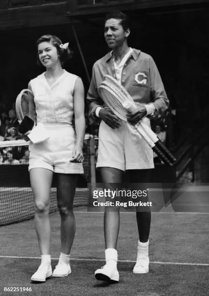 American tennis players Beverly Baker and Althea Gibson walk onto the court at Wimbledon, London, on the fifth day of the tournament, 29th June 1951.