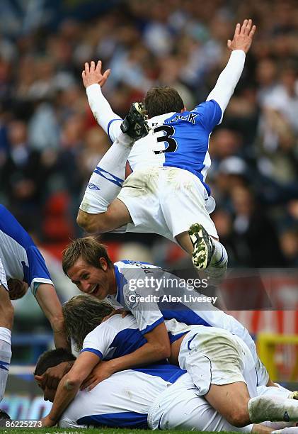 Ryan Nelsen of Blackburn Rovers is mobbed by his team mates after he scored his team's second goal during the Barclays Premier League match between...