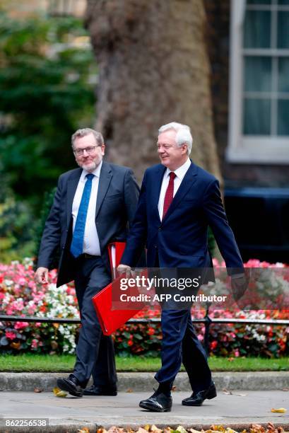 Britain's Secretary of State for Exiting the European Union David Davis and Secretary of State for Scotland David Mundell arrive at Downing Street...