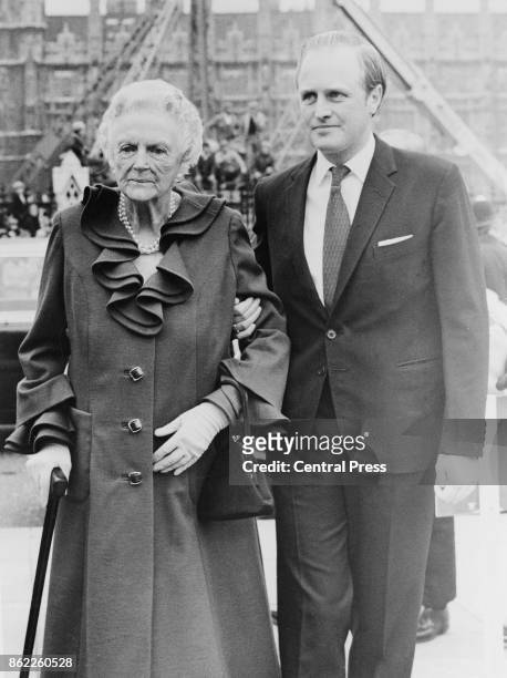 Clementine Churchill , Baroness Spencer-Churchill, the widow of Sir Winston Churchill, arrives at Parliament Square in London with her grandson...