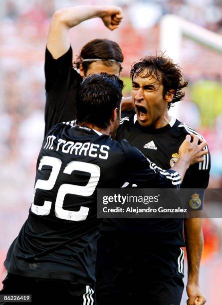 Raul Gonzalez of Real Madrid celebrates his goal with Miguel Torres during the La Liga match between Sevilla and Real Madrid at Sanchez Pizjuan...