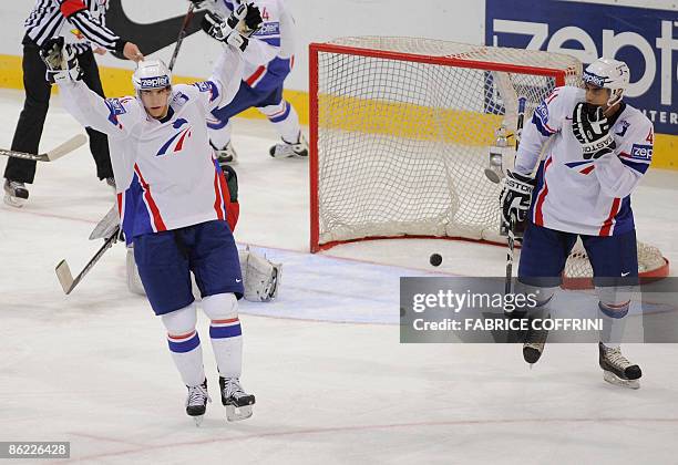 France's Kevin Hecquefeuille celebrates his team's first goal with teammate France's Pierre Edouart Bellemare during their Group B preliminary round...