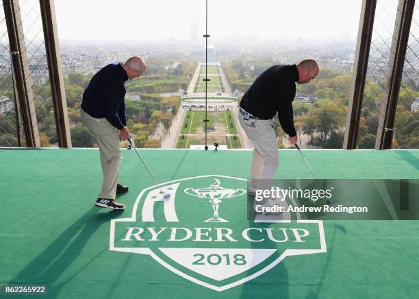 Jim Furyk, Captain of The United States and Thomas Bjorn, Captain of Europe tee off from a platform on the Eiffel Tower during the Ryder Cup 2018...