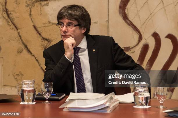 President of Catalonia, Carles Puigdemont, looks on during a government meeting at the Palau de la Generalitat building on October 17, 2017 in...