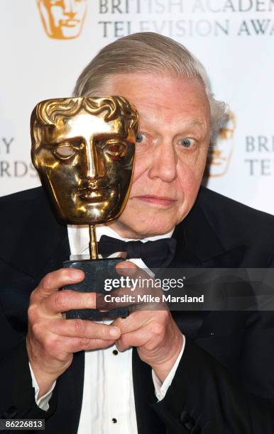 Sir David Attenborough poses with his award at the British Academy Television Awards Press Room at the Royal Festival Hall on April 26, 2009 in...