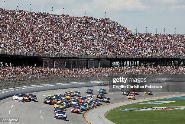 Dale Earnhardt Jr., driver of the National Guard / AMP Energy Chevrolet, leads a group of cars during the NASCAR Sprint Cup Series Aaron's 499 at...