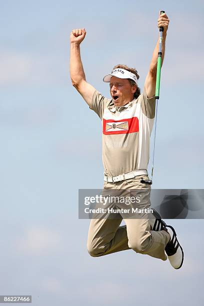 Bernhard Langer of Germany jumps in the air after making a 45 foot birdie on the first playoff hole during the final round of the Liberty Mutual...