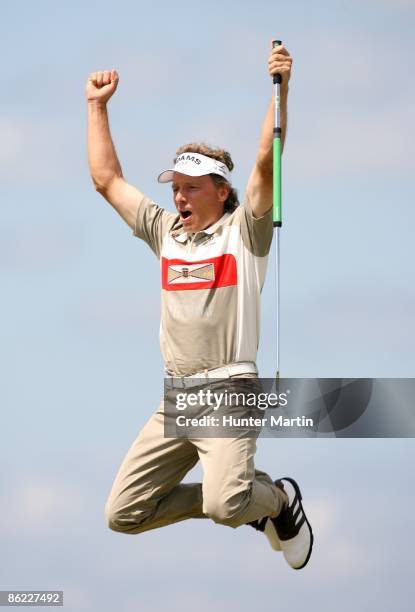 Bernhard Langer of Germany jumps in the air after making a 45 foot birdie on the first playoff hole during the final round of the Liberty Mutual...