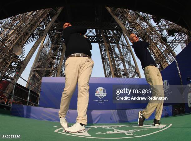 Jim Furyk, Captain of The United States and Thomas Bjorn, Captain of Europe tee off from a platform on the Eiffel Tower during the Ryder Cup 2018...