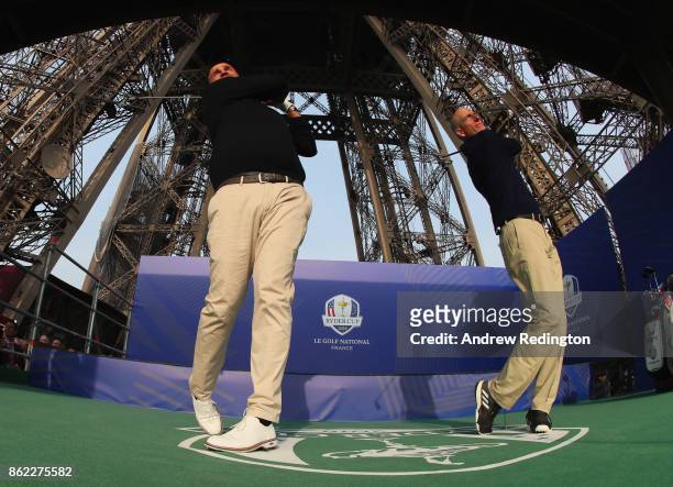 Jim Furyk, Captain of The United States and Thomas Bjorn, Captain of Europe tee off from a platform on the Eiffel Tower during the Ryder Cup 2018...