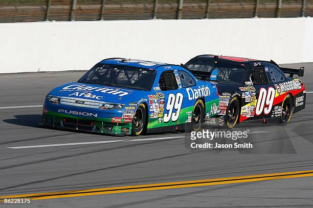 Carl Edwards, driver of the Claritin Ford and Brad Keselowski, driver of the Miccosukee Chevrolet, race during the final lap of the NASCAR Sprint Cup...