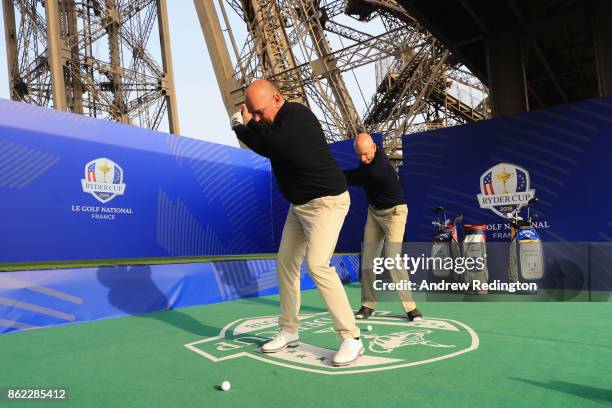 Jim Furyk, Captain of The United States and Thomas Bjorn, Captain of Europe tee off from a platform on the Eiffel Tower during the Ryder Cup 2018...