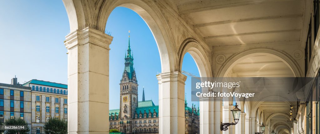 Hamburg Rathaus spire overlooking Alsterarkaden shopping arcade Rathausmarkt panorama Germany