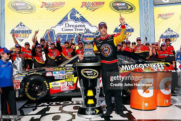 Brad Keselowski, driver of the Miccosukee Chevrolet, celebrates in victory lane after winning the NASCAR Sprint Cup Series Aaron's 499 at Talladega...