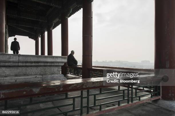 Visitor sits in a pavilion at the top of Jingshan Park in Beijing, China, on Tuesday, Oct. 17, 2017. President Xi Jinping is expected to emerge from...