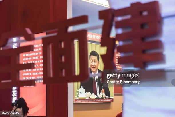 Photograph of Chinese President Xi Jinping is displayed at the "Five Years of Sheer Endeavor" show at the Beijing Exhibition Center in Beijing,...