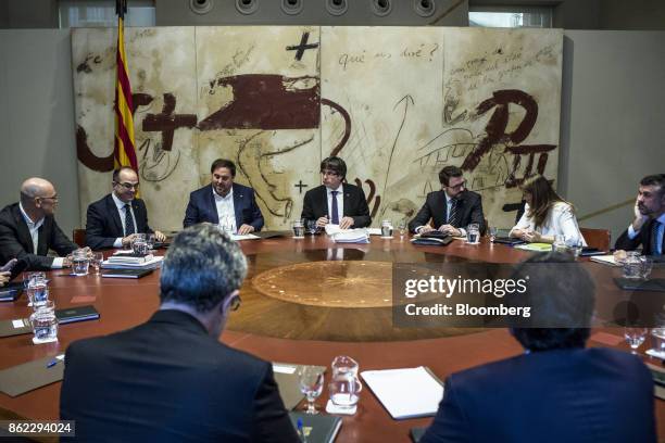 Carles Puigdemont, Catalonia's president, center, Oriol Junqueras, leader of Esquerra Republicana de Catalunya, center left, Jordi Turull, Catalonia...