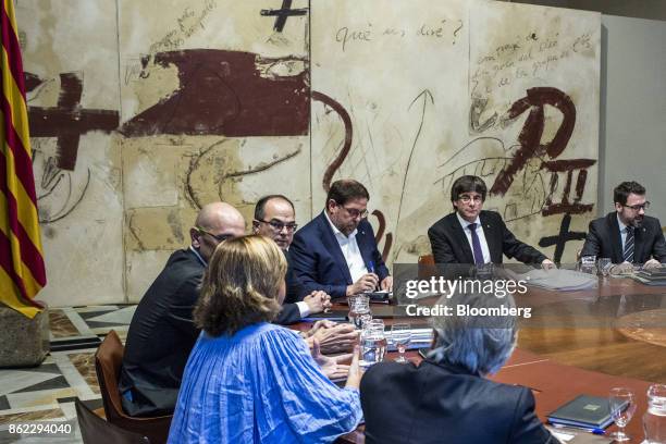 Carles Puigdemont, Catalonia's president, second right, Oriol Junqueras, leader of Esquerra Republicana de Catalunya, center, Jordi Turull, Catalonia...