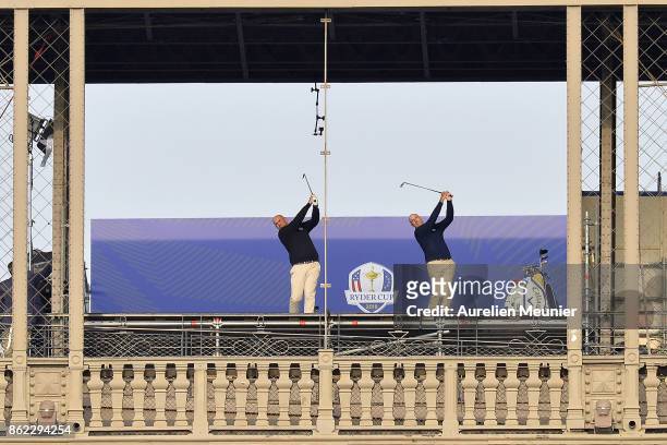 Jim Furyk, Captain of The United States and Thomas Bjorn, Captain of Europe tee off from a platform on the Eiffel Tower during the Ryder Cup 2018...