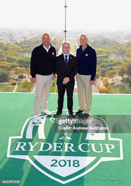 Jim Furyk, Captain of The United States and Thomas Bjorn, Captain of Europe pose with PGA European Tour CEO Keith Pelley on a platform on the Eiffel...