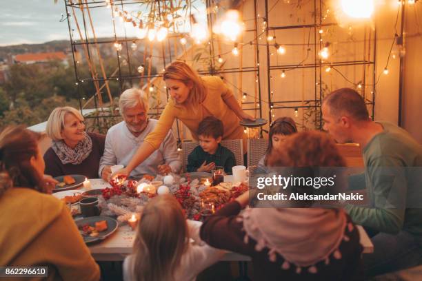 thanksgiving dinner with family - baby boomer generation stock pictures, royalty-free photos & images