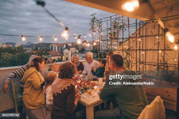 thanksgiving dinner with family - balcony party stock pictures, royalty-free photos & images