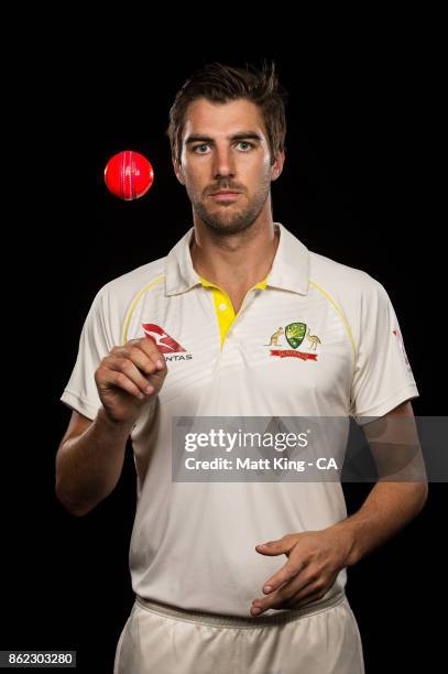 Pat Cummins of Australia poses with a pink ball during the Australia Test cricket team portrait session at Intercontinental Double Bay on October 15,...