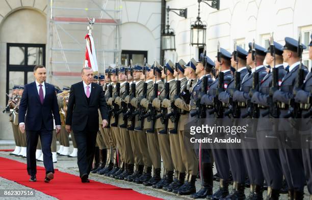 Turkish President Recep Tayyip Erdogan walks past the honour guards with Polish President Andrzej Duda during the official welcoming ceremony at the...