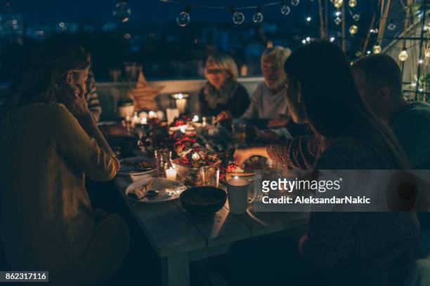 precious family moments during thanksgiving dinner - evening meal stock pictures, royalty-free photos & images