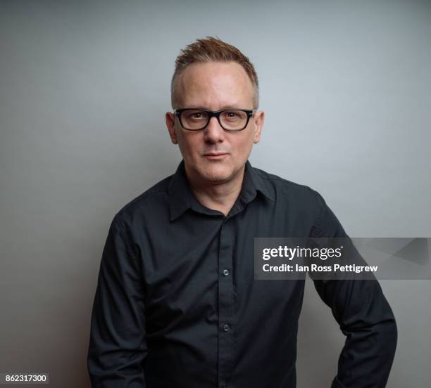 portrait of middle-aged man in dark shirt - black shirt stockfoto's en -beelden