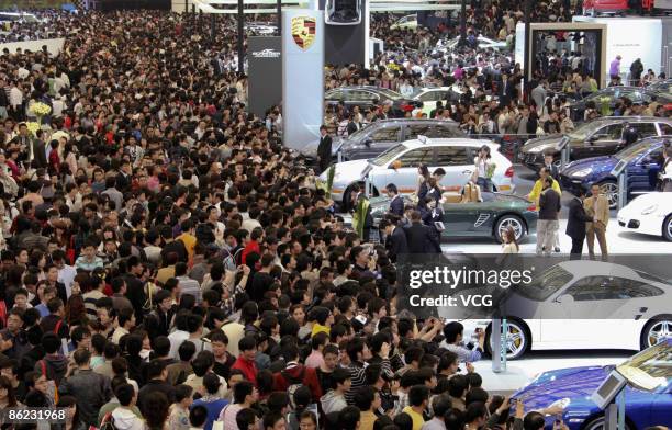 People crowd the exhibition area of auto companies during the 2009 Auto Shanghai at the Shanghai New International Expo Center on April 26, 2009 in...