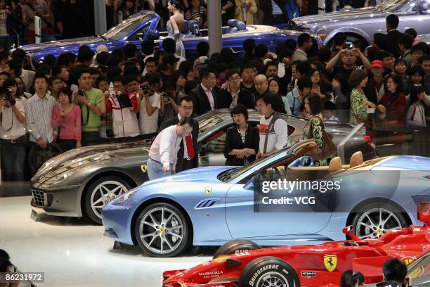 People crowd the exhibition area of auto companies during the 2009 Auto Shanghai at the Shanghai New International Expo Center on April 26, 2009 in...