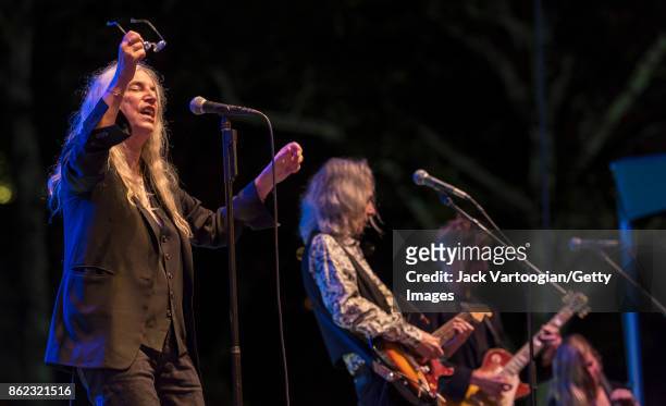 American Rock musician and poet Patti Smith leads her band during a tribute to her late husband, guitarist Fred 'Sonic' Smith, at Central Park...