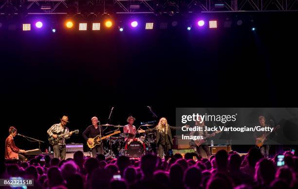 American Rock musician and poet Patti Smith leads her band during a tribute to her late husband, guitarist Fred 'Sonic' Smith, at Central Park...